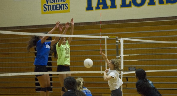 Girls volleyball team practices after school for upcoming game.