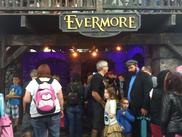 Attendees gather to see the Evermore stand and get a sneak peek of what to expect of the soon to be park that opens in 2015