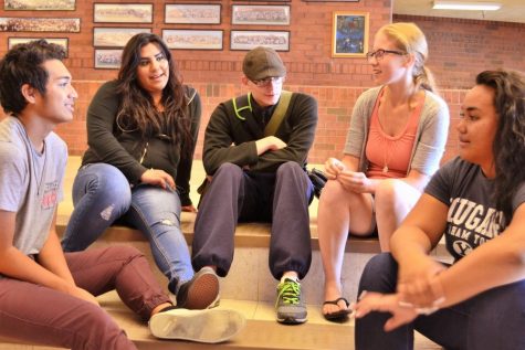 Students of various backgrounds chat as a group without a difference between students who are neurotypical and those who aren't.