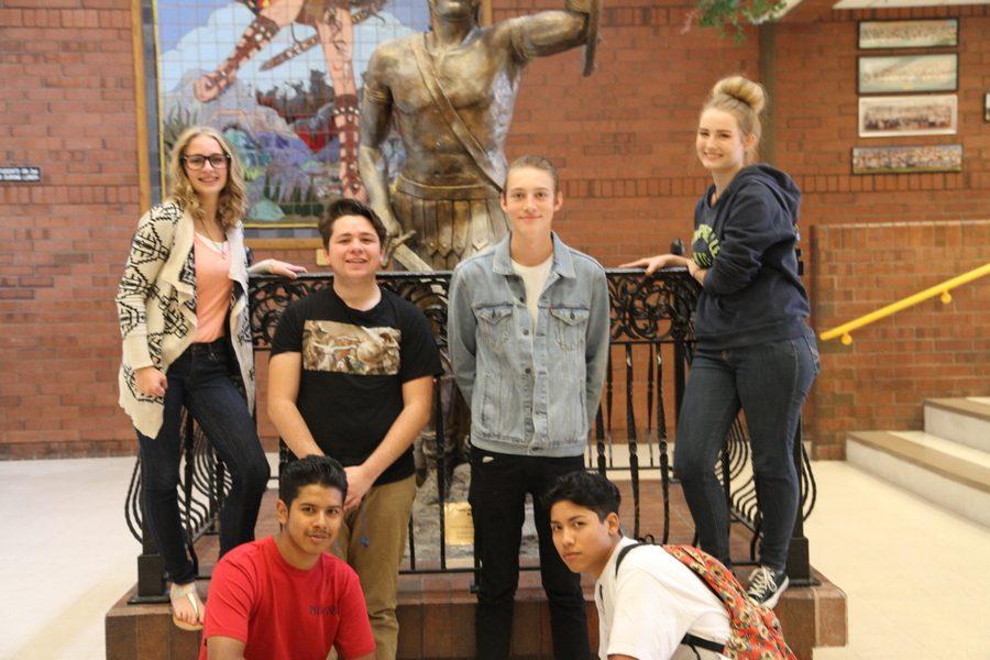 (From the top left to bottom right) Taylor Cherry, Bryan Lozano, Bryson Vincent, Rylee Holt, John Doe, and Sebastian Colderon pose in front of the Taylorsville Warrior statue.