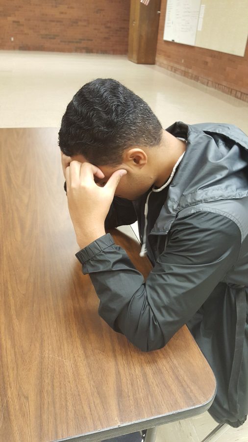 A student sits by himself at school; isolation and feelings of hopelessness are among the main issues suicide prevention resources are trying to address.