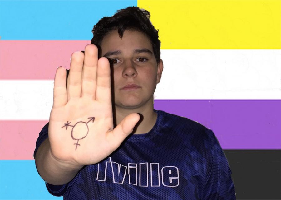 Non-binary Student Jordan Harvey poses with gender marker, indicative of how they dont fit within the standard gender identities. 