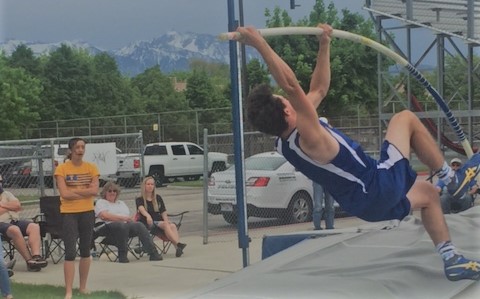 Taylorsville Pole Vaulting team in tryouts. 2018 Senior Pole Vaulter, Jordan Glade, attempts to plant the pole to vault over the bar.