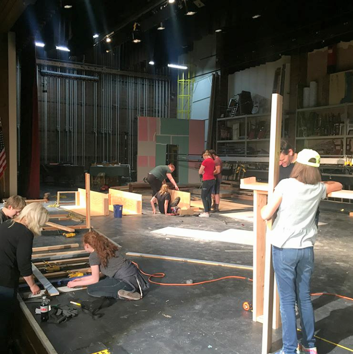 The stage crew works on building a set for the school musical, How To Succeed in Business Without Really Trying.