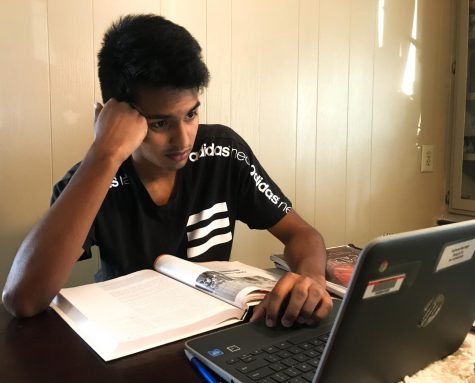 Senior Jose Vasquez works on his schoolwork during the COVID-19 pandemic.