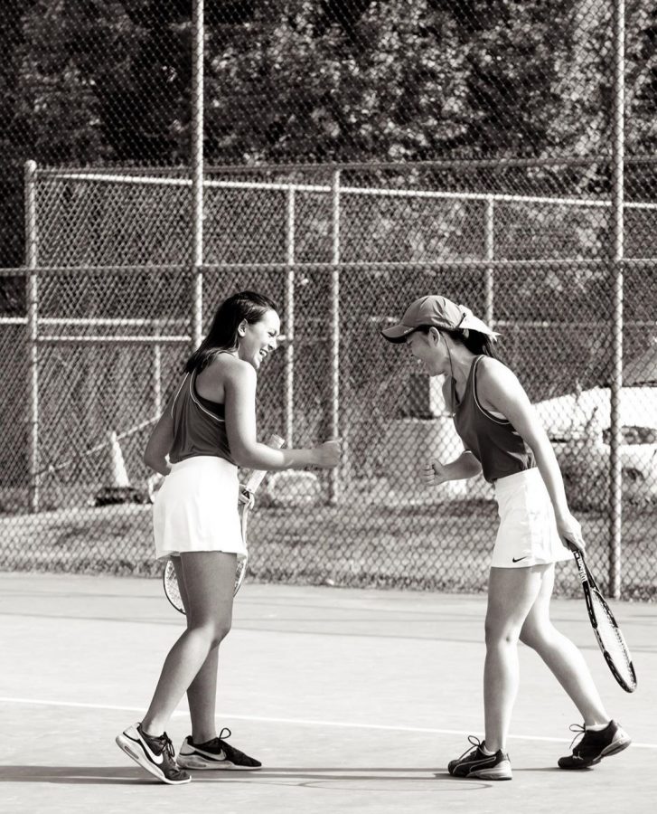 Doubles partners Brooklyn Lee and Athena Lam celebrate after winning a game.