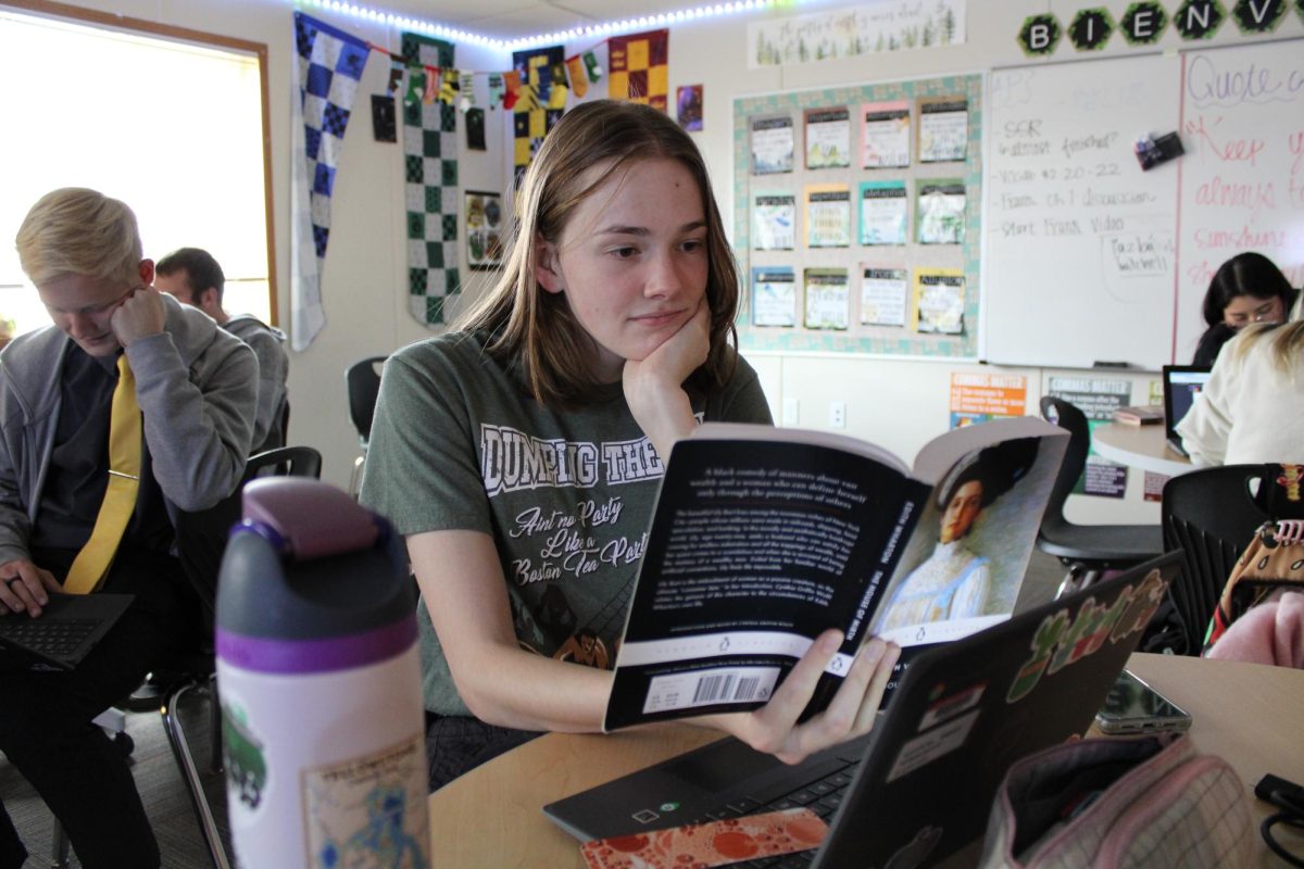 Senior Rachel Troth is reading in her AP Literature class.