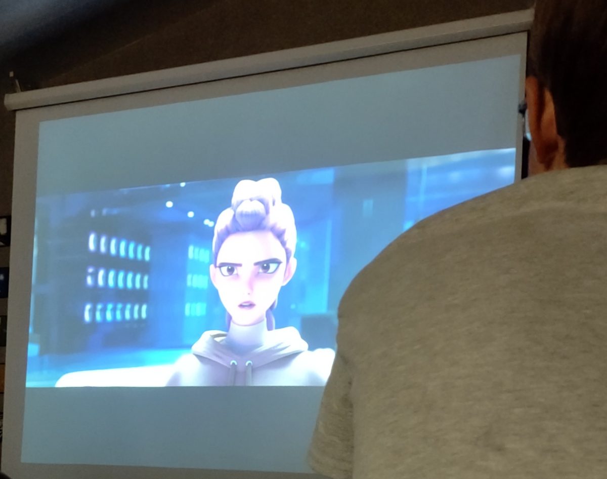 A student is watching K-Pop Demon Hunters on a screen